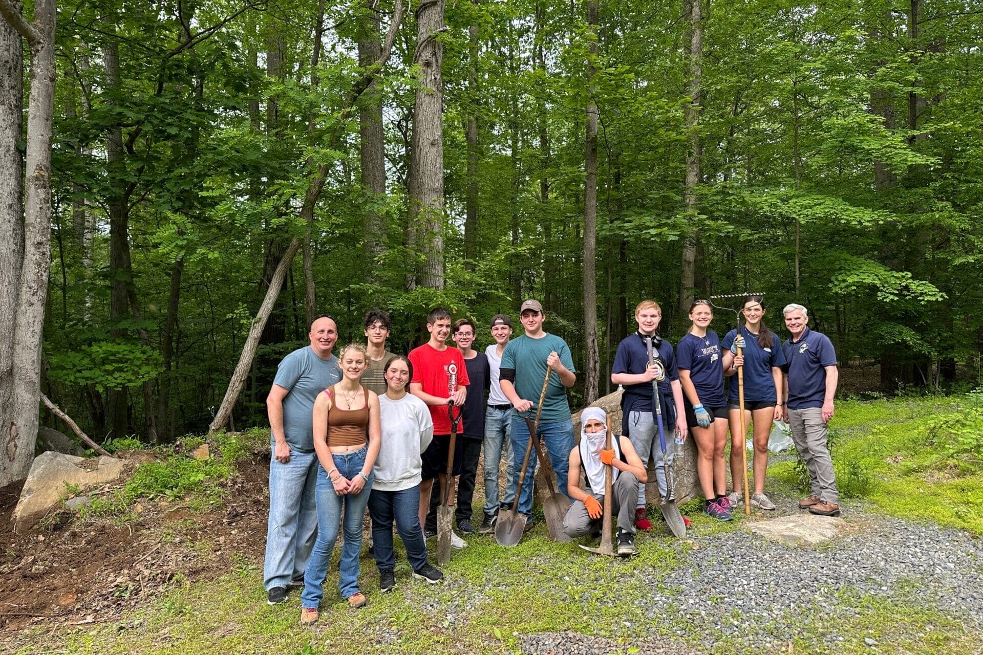 JROTC Cadets pose along the trail where they spread gravel.